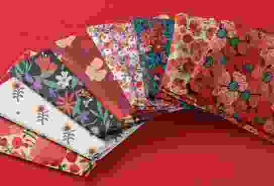 photograph of fabrics printed with red flower surface patterns