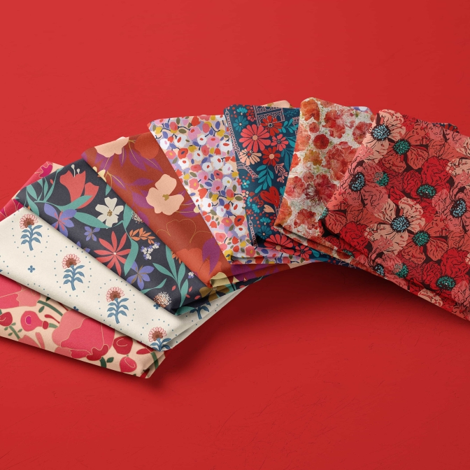 photograph of fabrics printed with red flower surface patterns